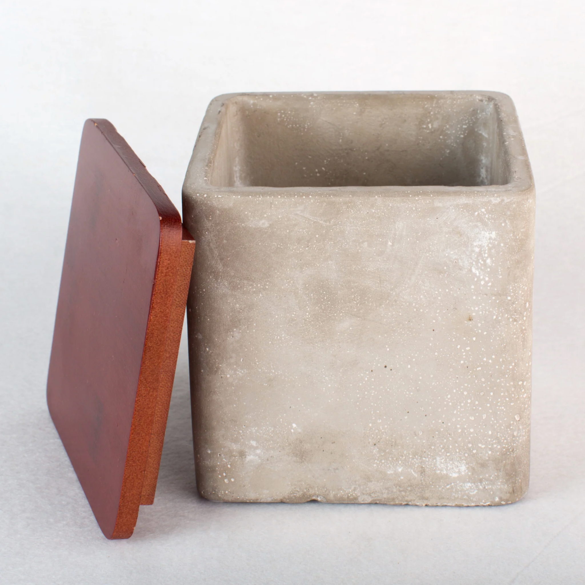 Stone cement square storage box with bamboo lid, rustic and industrial design, ideal for kitchen or bathroom organization, available in two sizes.