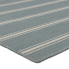 Blue gray stripe rug with flatwoven 100% PET yarns, handwoven in India, featuring thin and thick slate and ivory stripes, low 1/3" pile.