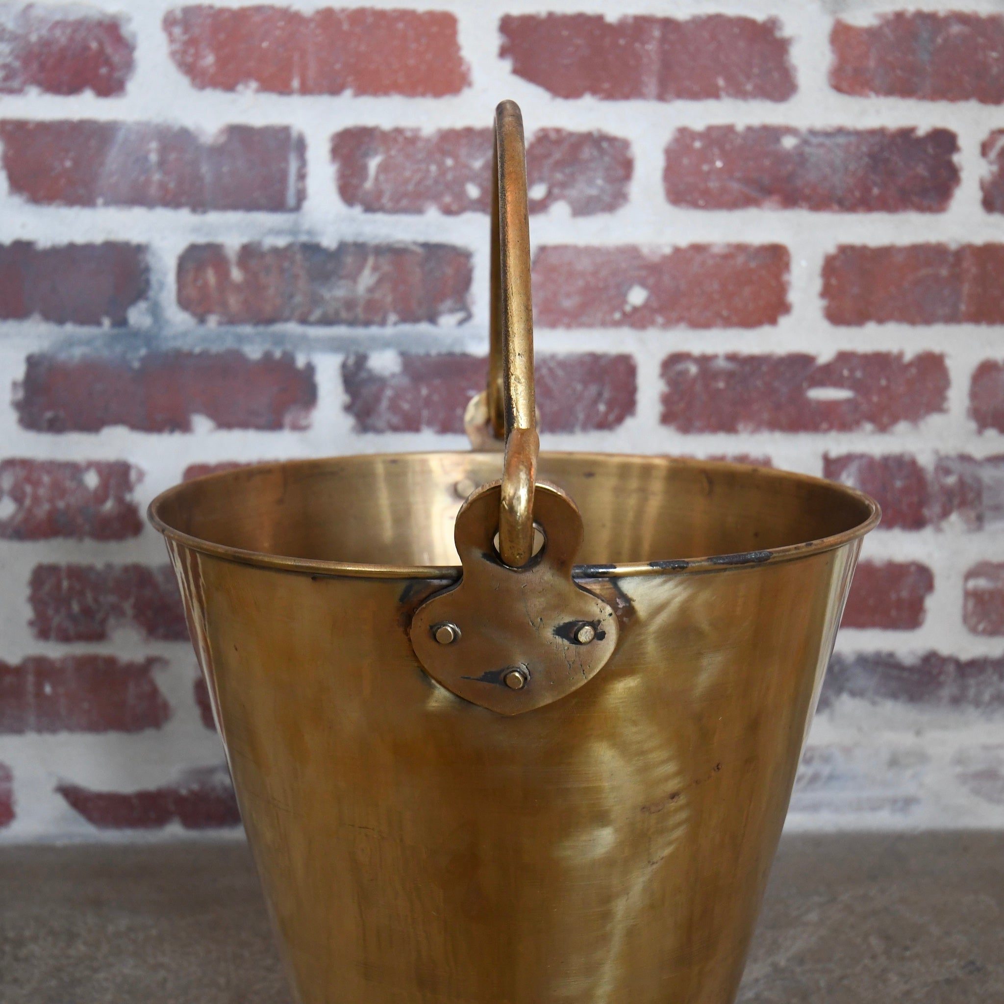 brass bucket with handle.