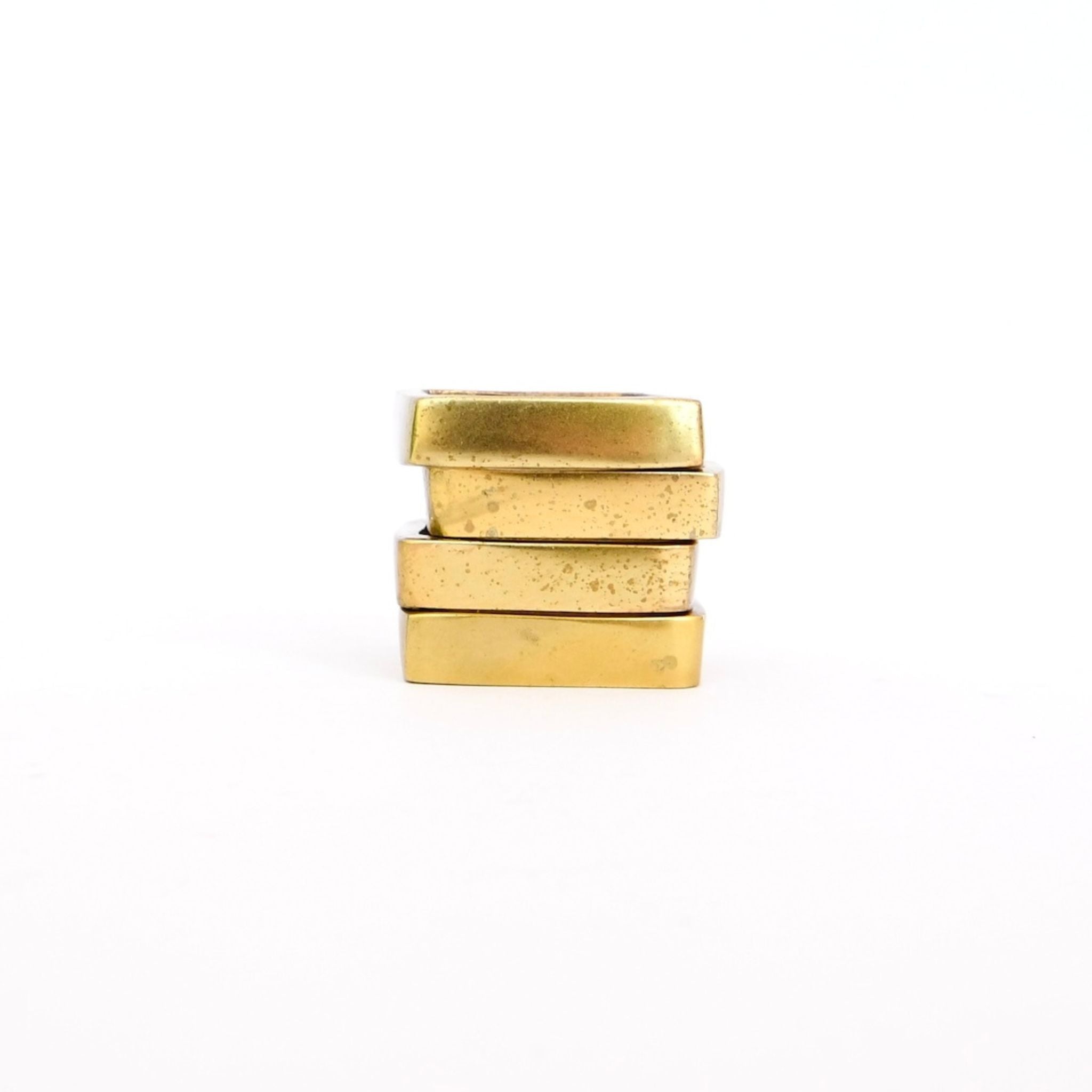brass tone square napkin rings set of four.