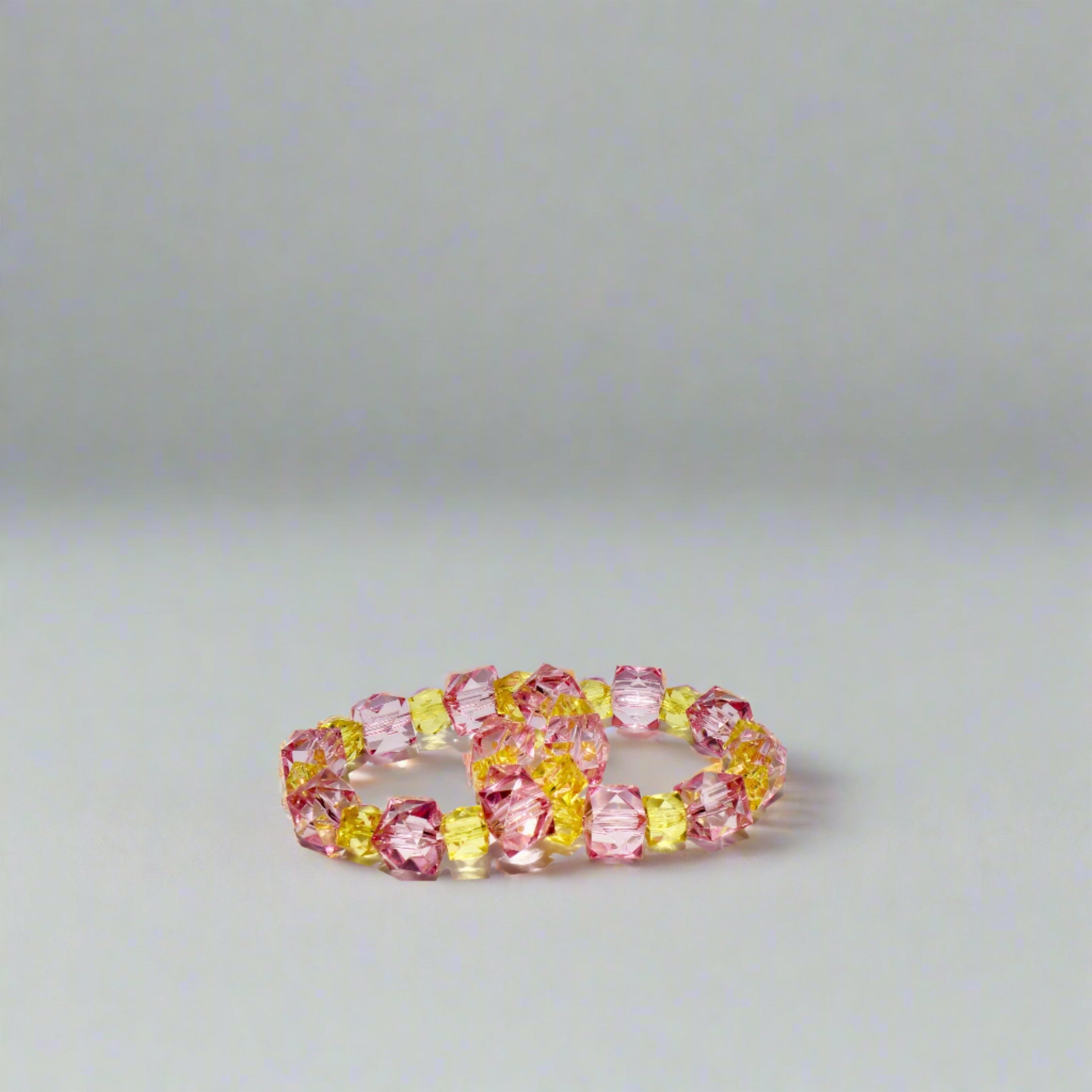 kids rock candy 2-tone stretch bracelets, pink and yellow.