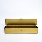 Brass metal storage box with decorative lid for shelves, modern home decor accessory.