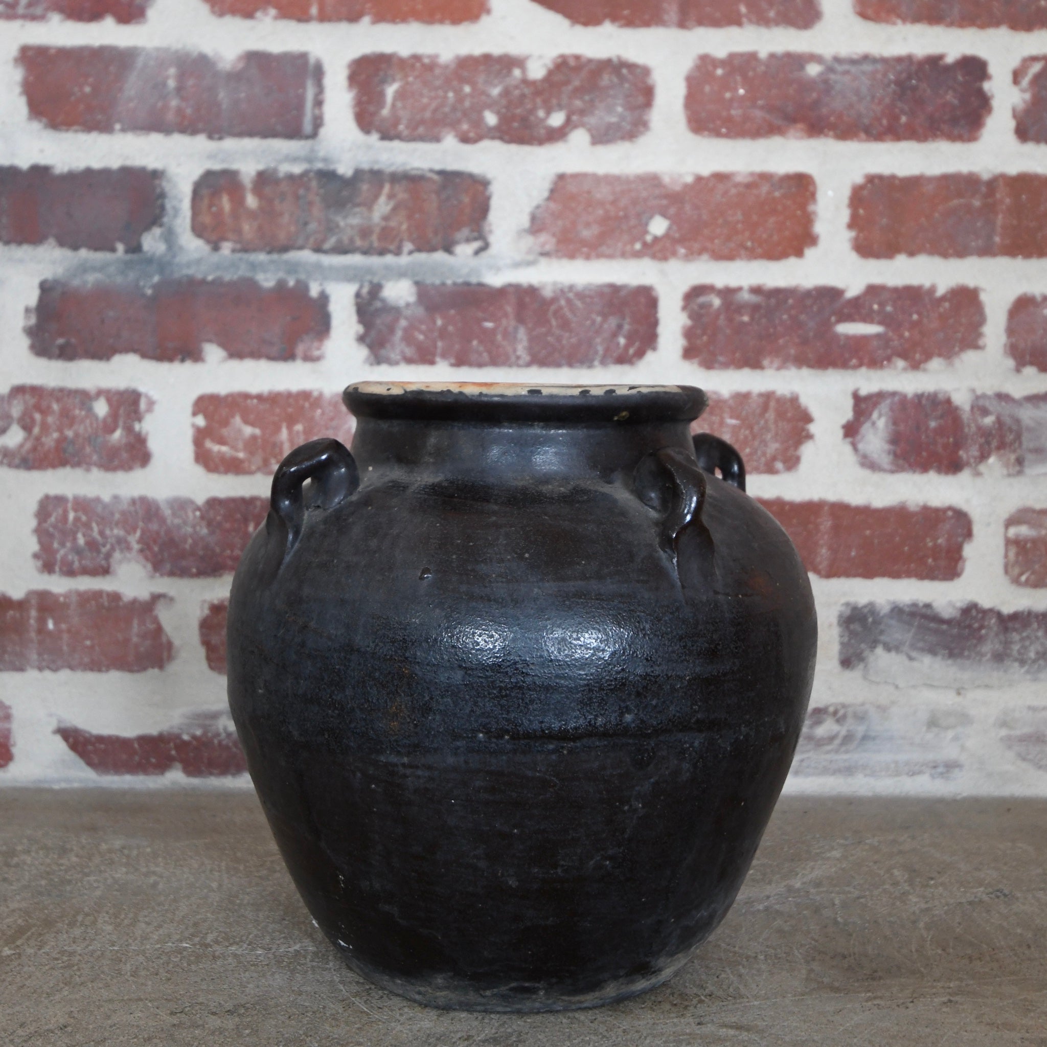 large glazed 4-handle pot black.