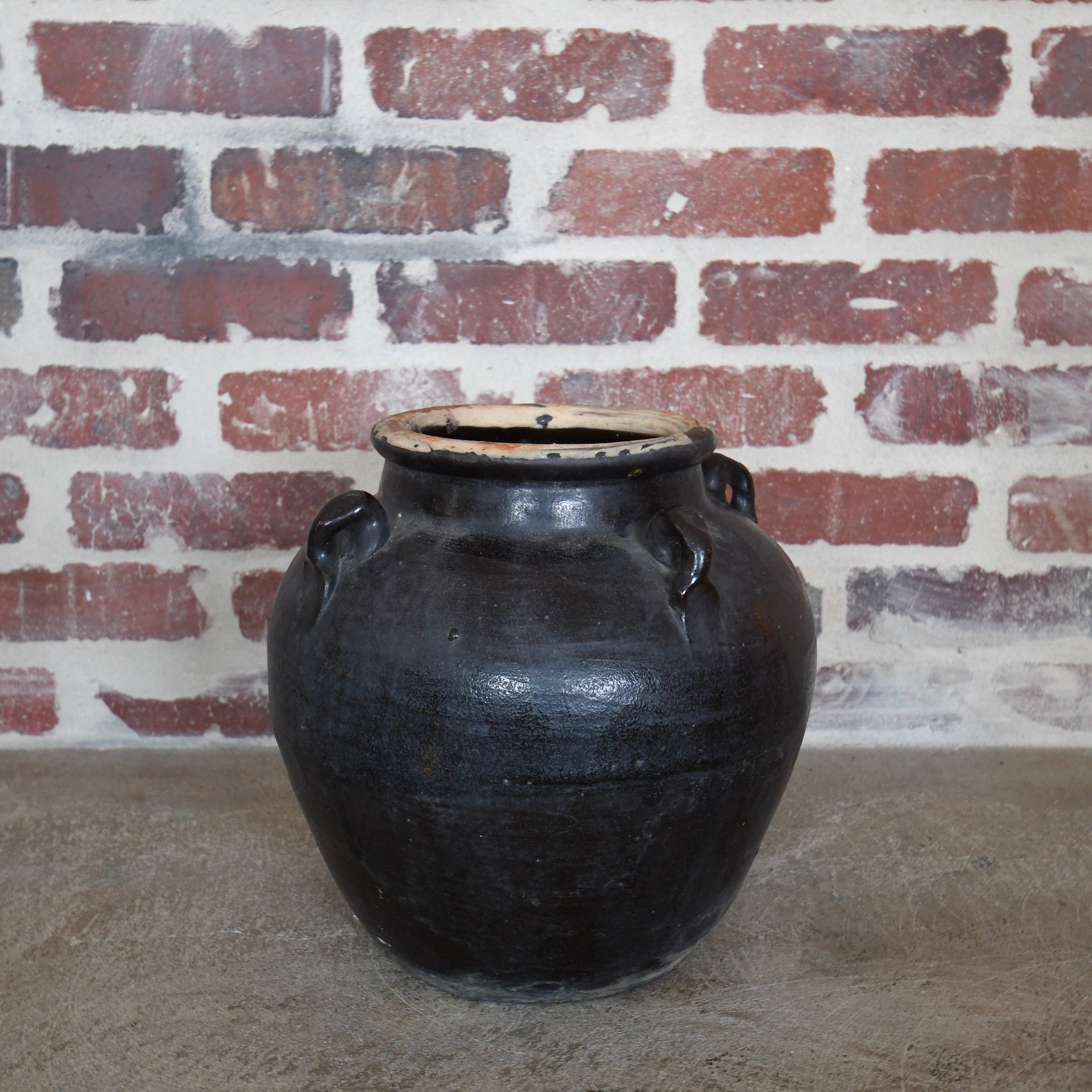 large glazed 4-handle pot black.