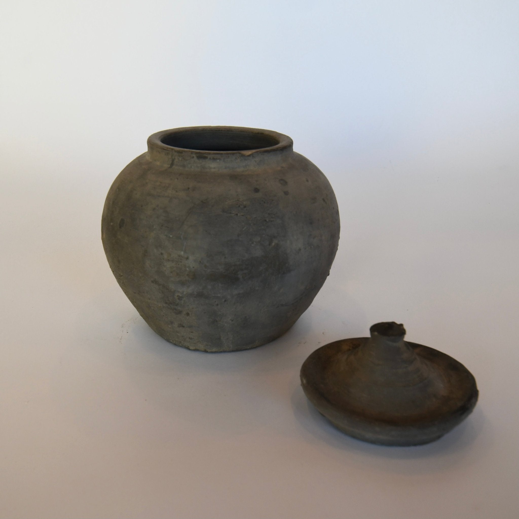 Lidded Village Jar in grey patinaed clay, 7-inch diameter by 9-inch height, rustic Chinese pottery style with removable lid for storage or décor.
