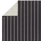 Navy stripe rug with handwoven flatwoven PET yarns, featuring thin and thick navy and ivory stripes, low 1/3" pile, durable polypropylene backing.