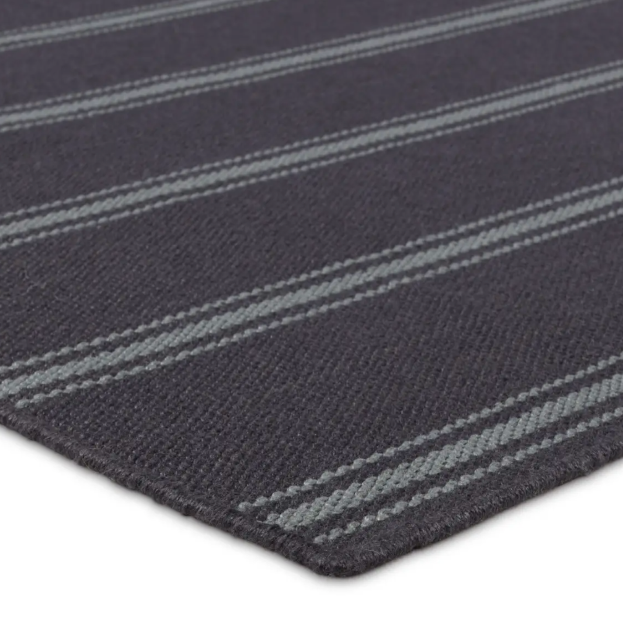 Navy with blue gray stripe rug, handwoven flatwoven PET yarns, featuring thin and thick stripes in navy and light blue, low 1/3" pile.