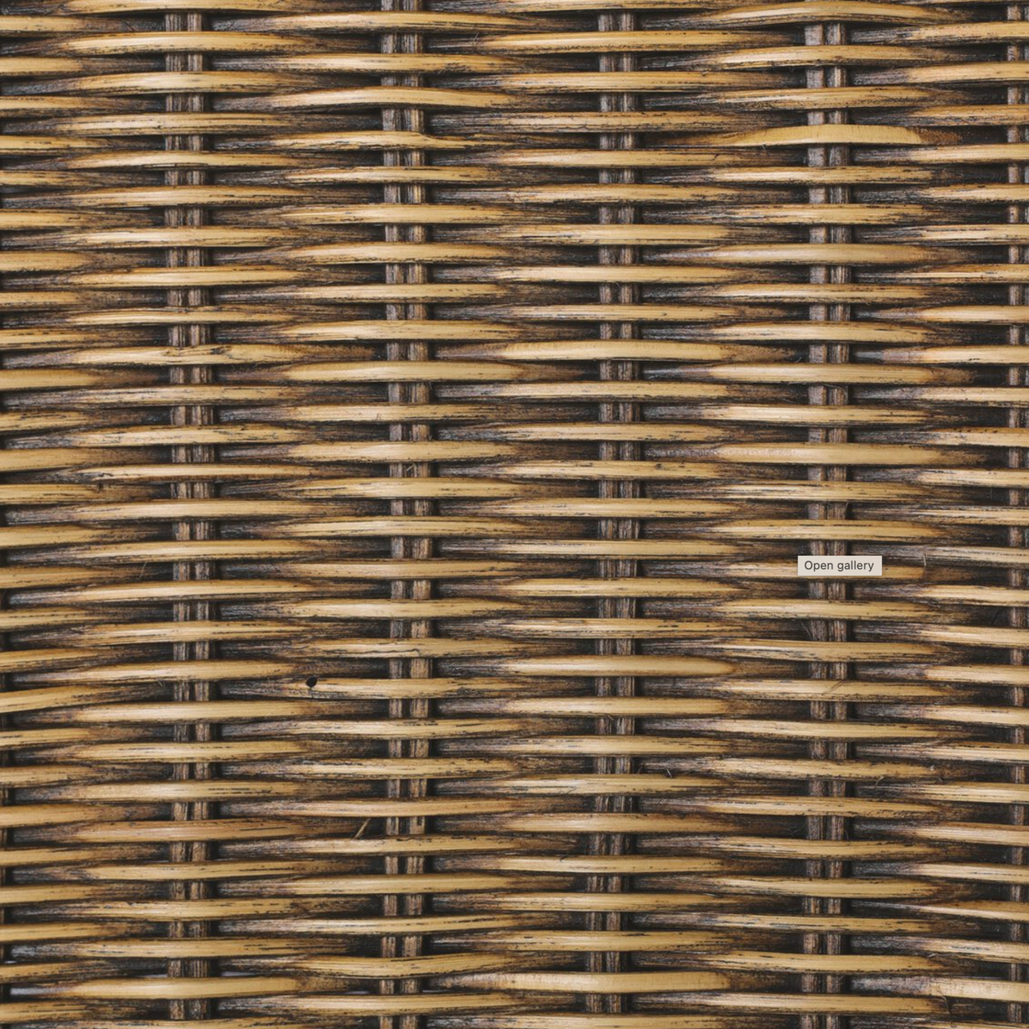 Right arm facing small dining bench with woven natural brown rattan frame and flax/linen cushion in Broadway Dune, 49 inches wide, ideal for casual seating.