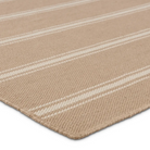 Tan stripe rug with flatwoven PET yarns, handwoven in India, featuring beige and ivory thin and thick stripes, low 1/3" pile.