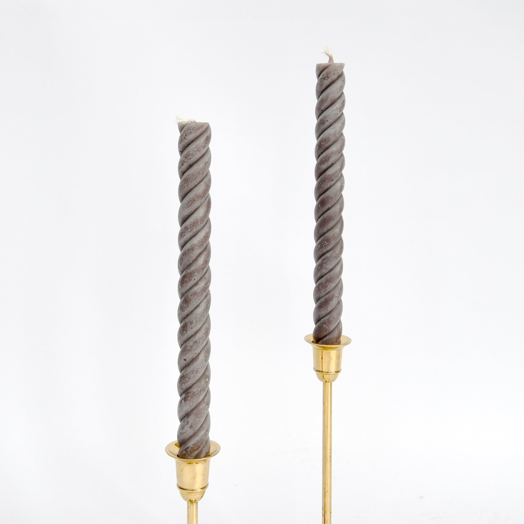 Set of two gray twisted rope 10" taper candles, hand-poured in New York from pure beeswax, burn clean and add elegant style to any table.
