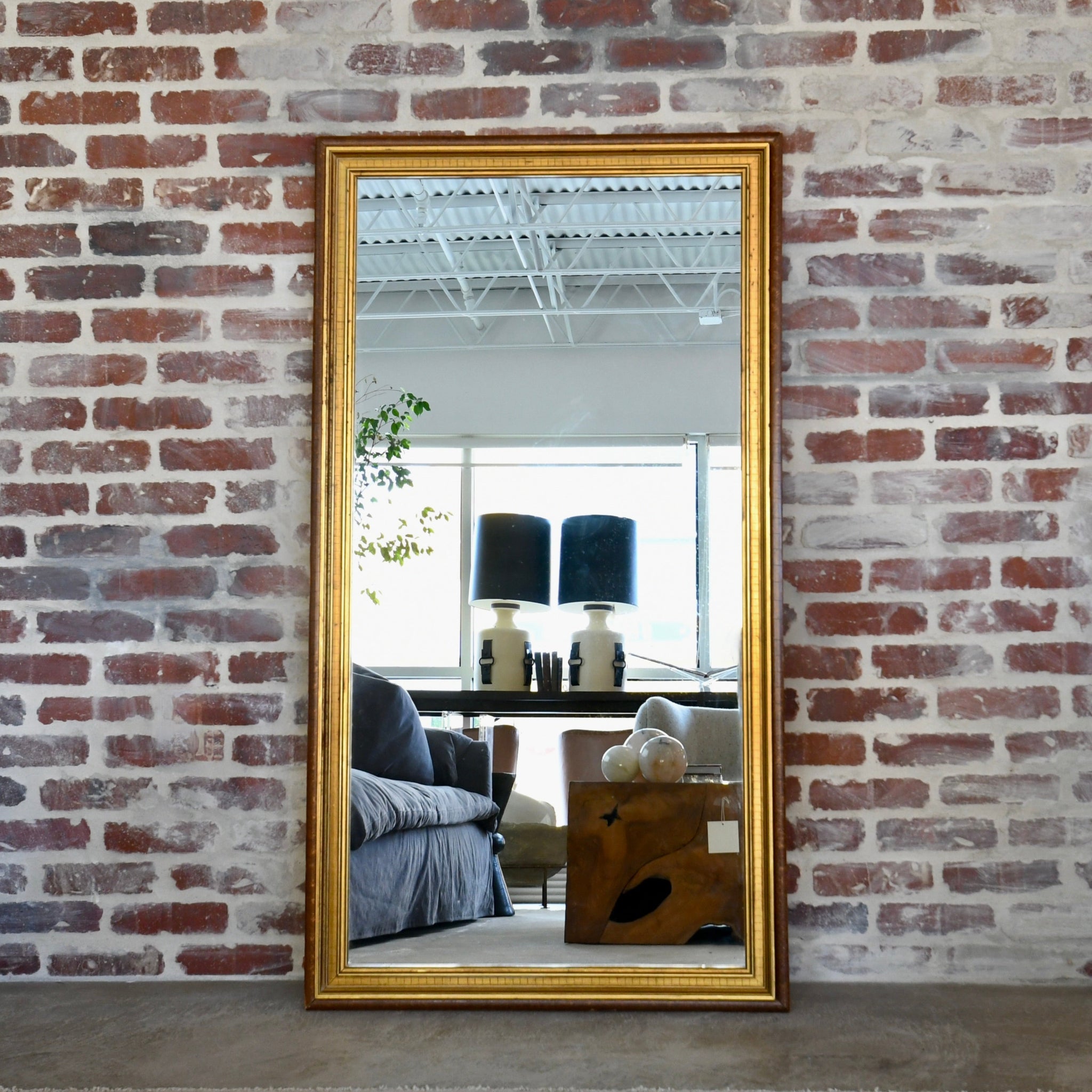 Vintage rectangular mirror with patinated wood frame and gold accents, versatile for horizontal or vertical display, perfect for antique home décor.