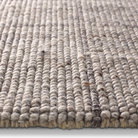 Windowpane Check Rug in greige with handwoven 2/3-inch pile, durable polyester-wool blend, featuring gray and taupe grid pattern.