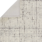 Woven white and grey rug with basket weave texture, handwoven wool, neutral ivory and charcoal gray tones, plush and durable.