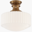 Sophisticated Milton Road Flush Mount featuring Hand-Rubbed Antique Brass and White Glass