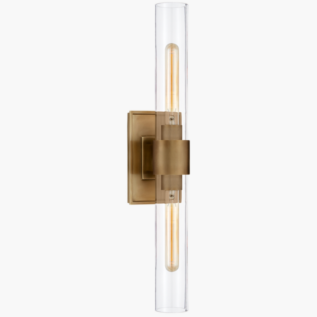 Stylish Presidio Double Sconce – antique brass and clear glass.