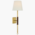 Luxurious Griffin Tail Sconce – brass and saddle leather with soft linen shade.