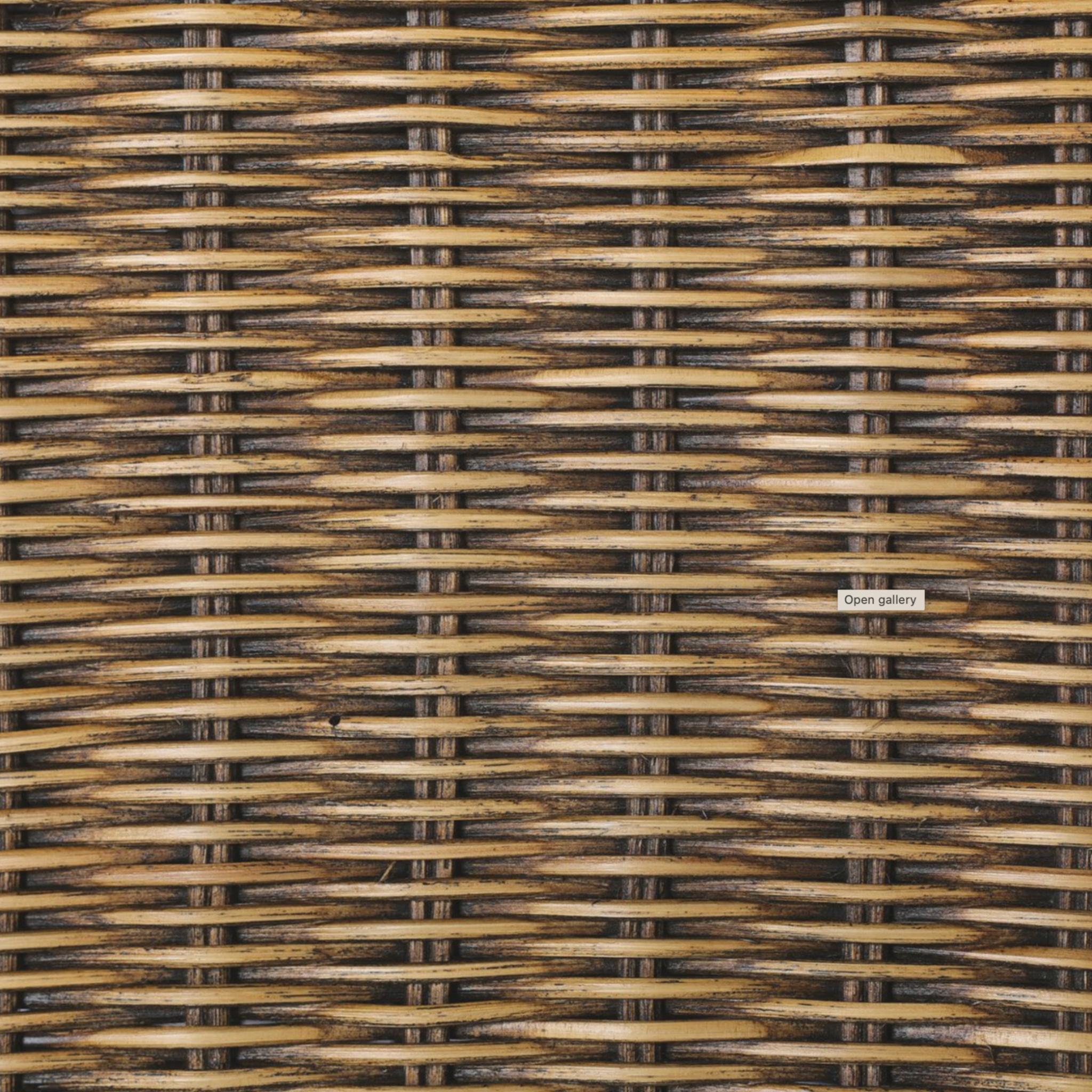 rattan left arm facing large dining bench.
