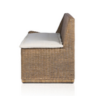 rattan left arm facing large dining bench.