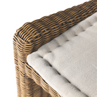 rattan left arm facing small dining bench.