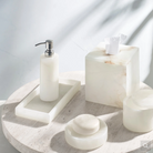 Alabaster tissue holder with natural white stone and sandy grey veining, adding elegant and unique bathroom décor.
