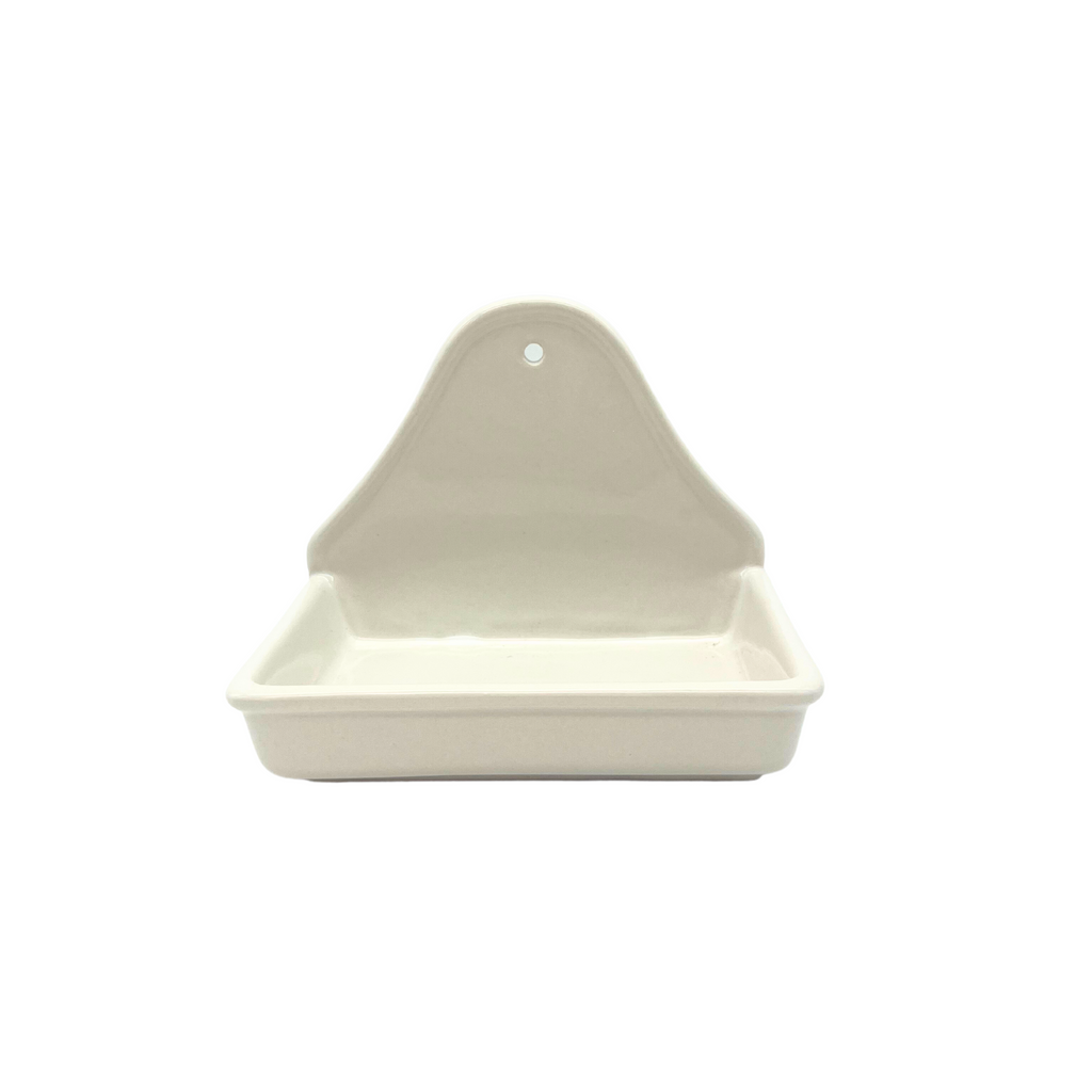 A white Creative CO-OP premium stoneware soap dish with a ridged base and a raised back with a hole for wall mounting.
