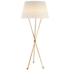 "62" Brass Floor Lamp by Aerin Lebon casting warm light"