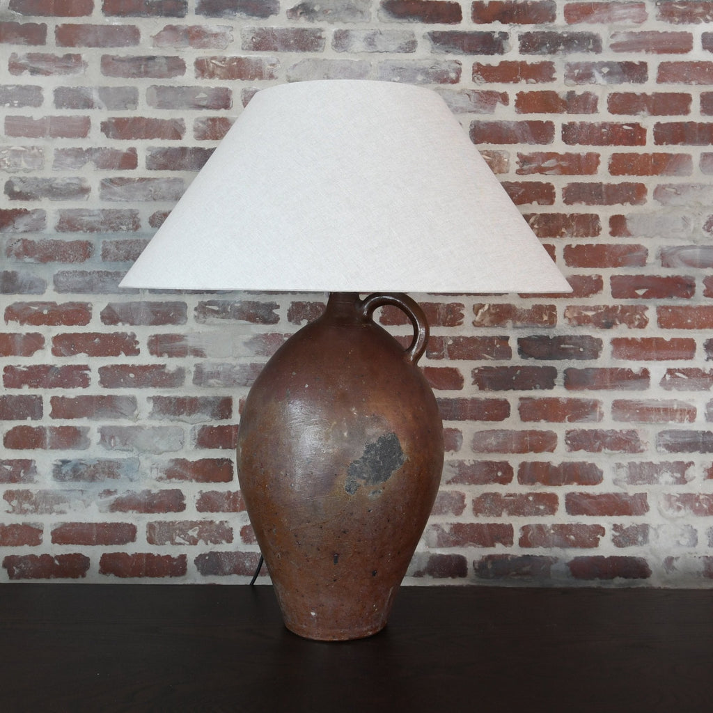 "Antique Ceramic Table Lamp with intricate patterns casting warm light"