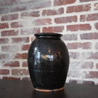 "Glossy Antique Terracotta Vase as a centerpiece on a dining table"