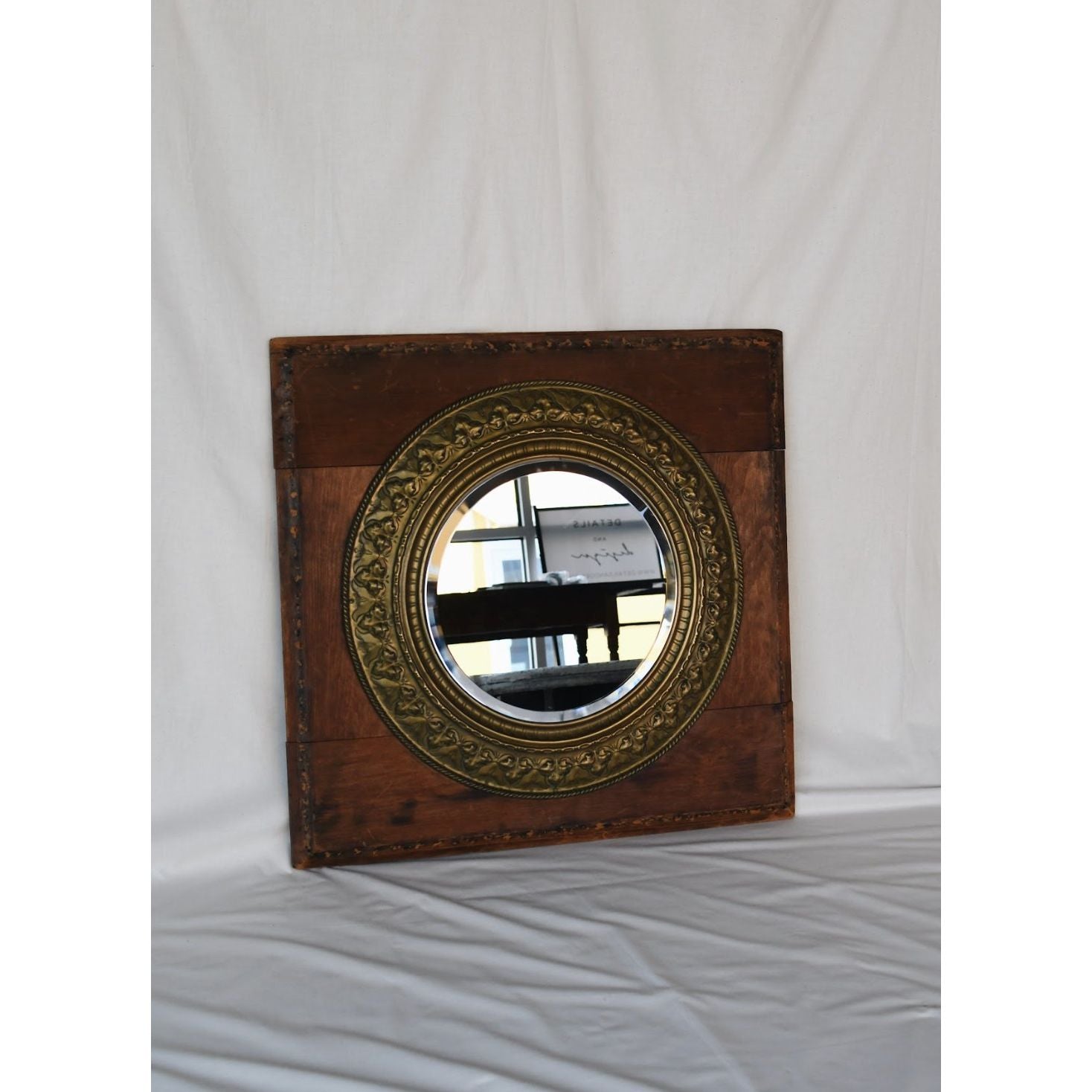 Antique Square Medallion Mirror with brass-framed circular design.