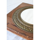 Luxurious Antique Square Medallion Mirror featuring rich wooden base.