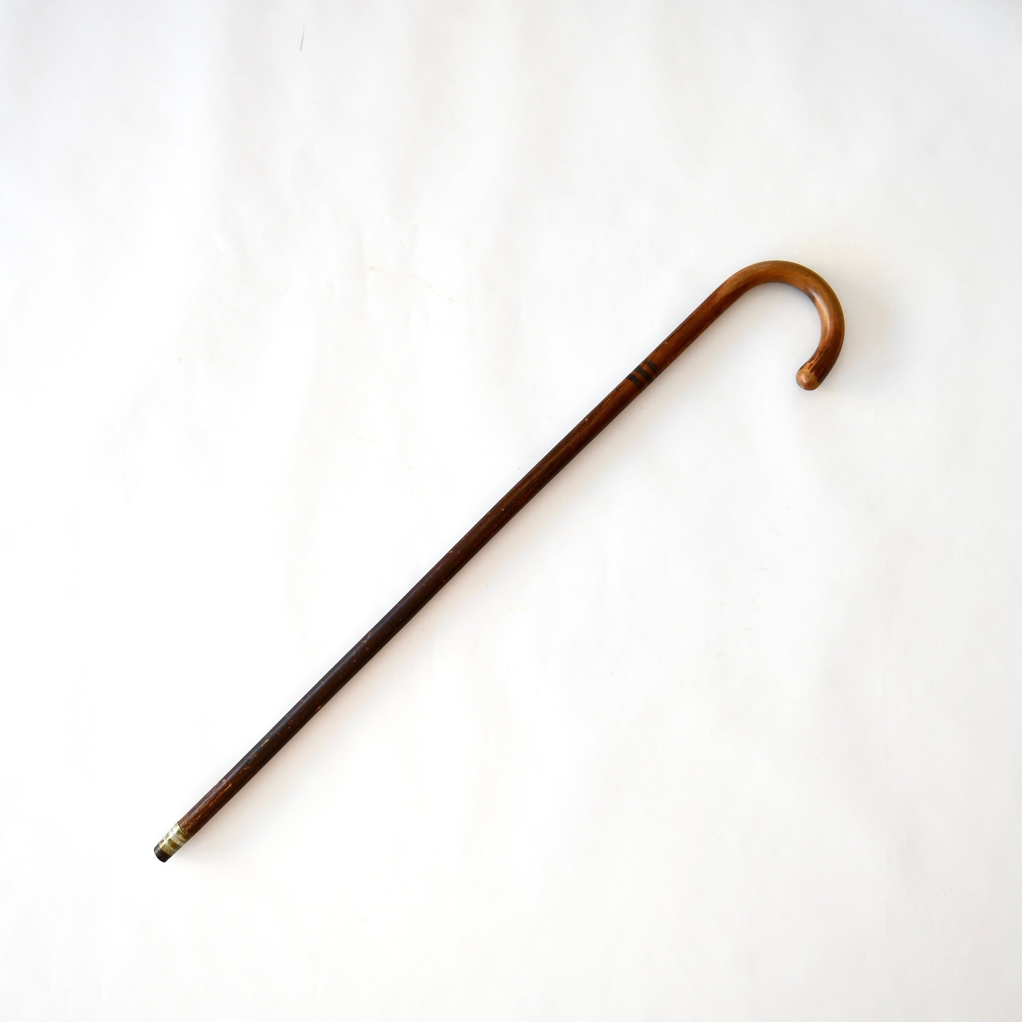 "Elegant antique walking cane for vintage mobility support"