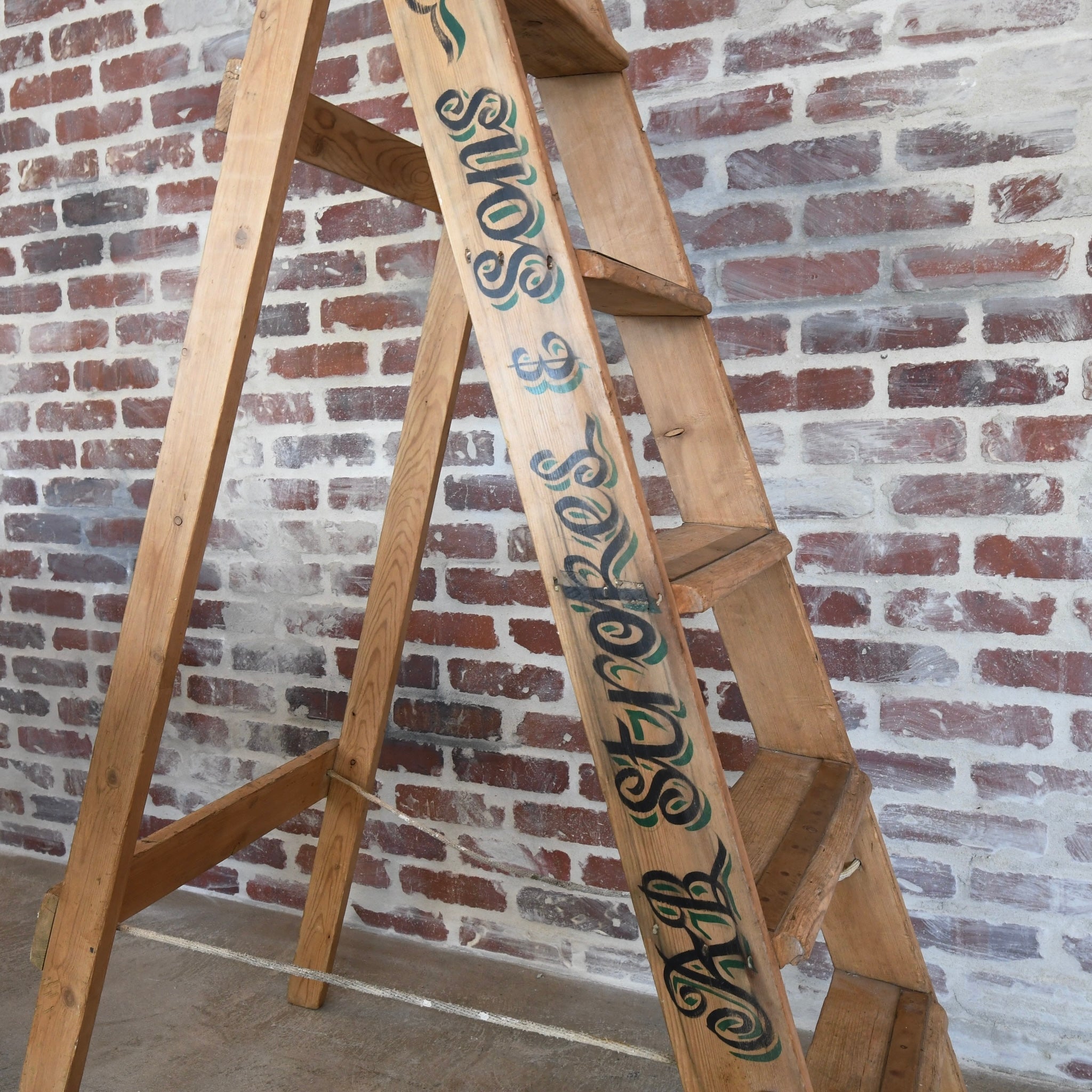 Classic Antique Wooden Ladder leaning against a wall in a cozy home