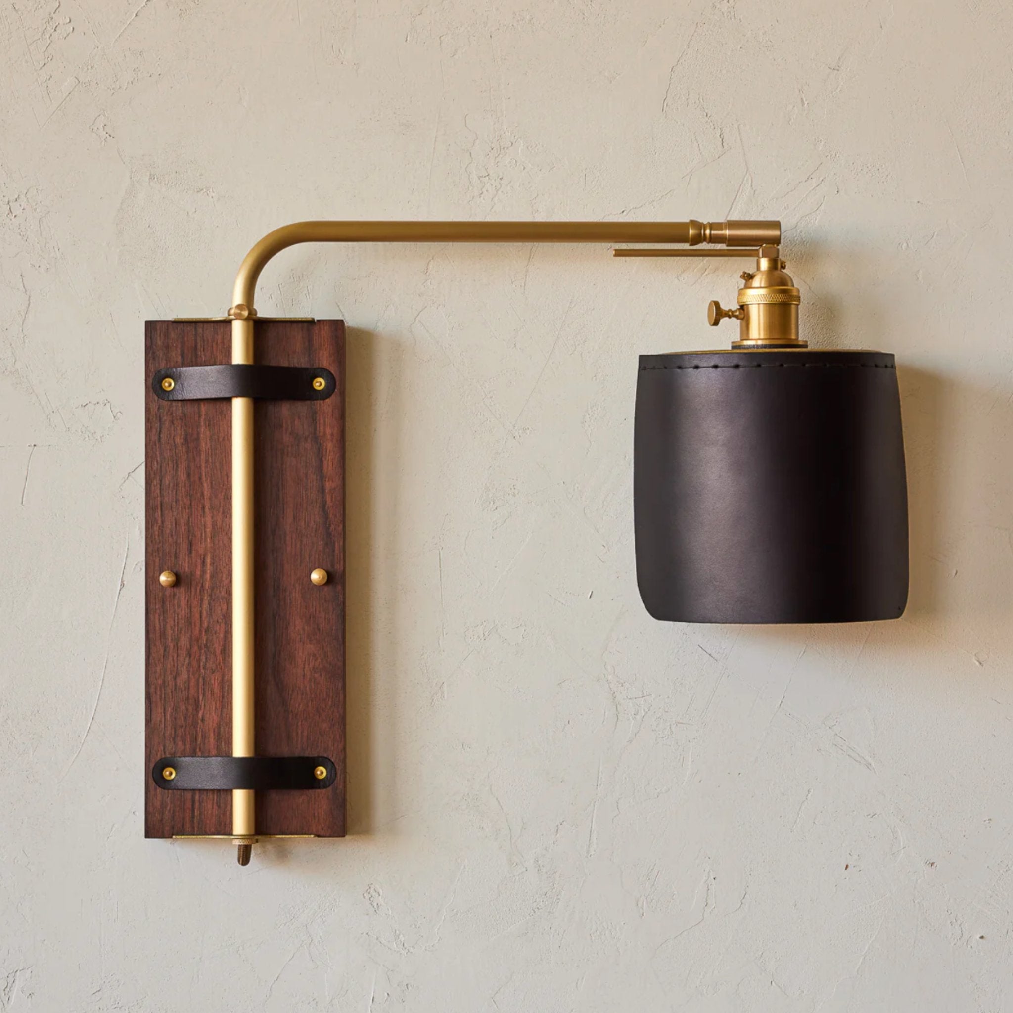 Handcrafted Ava Wall Sconce in black walnut, brass, and leather