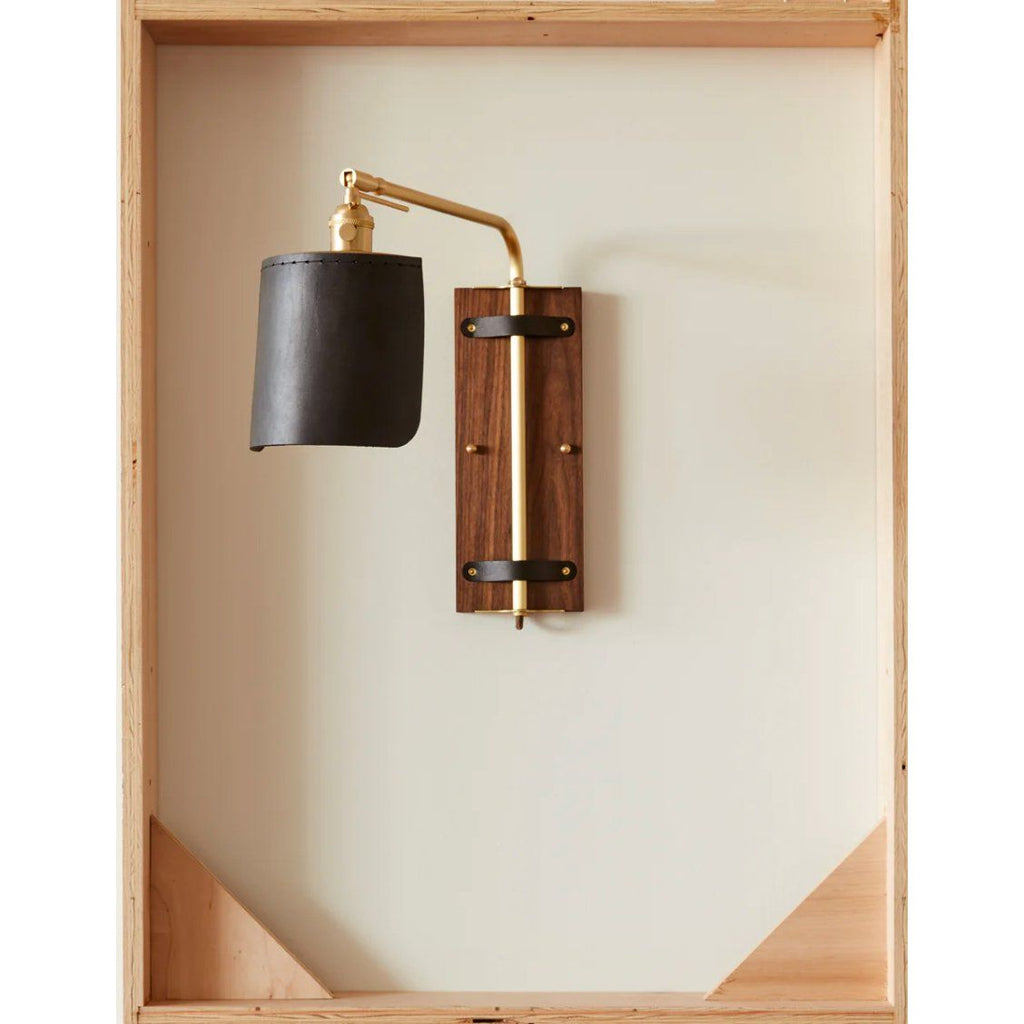 Luxurious Ava Wall Sconce featuring black walnut and brass accents