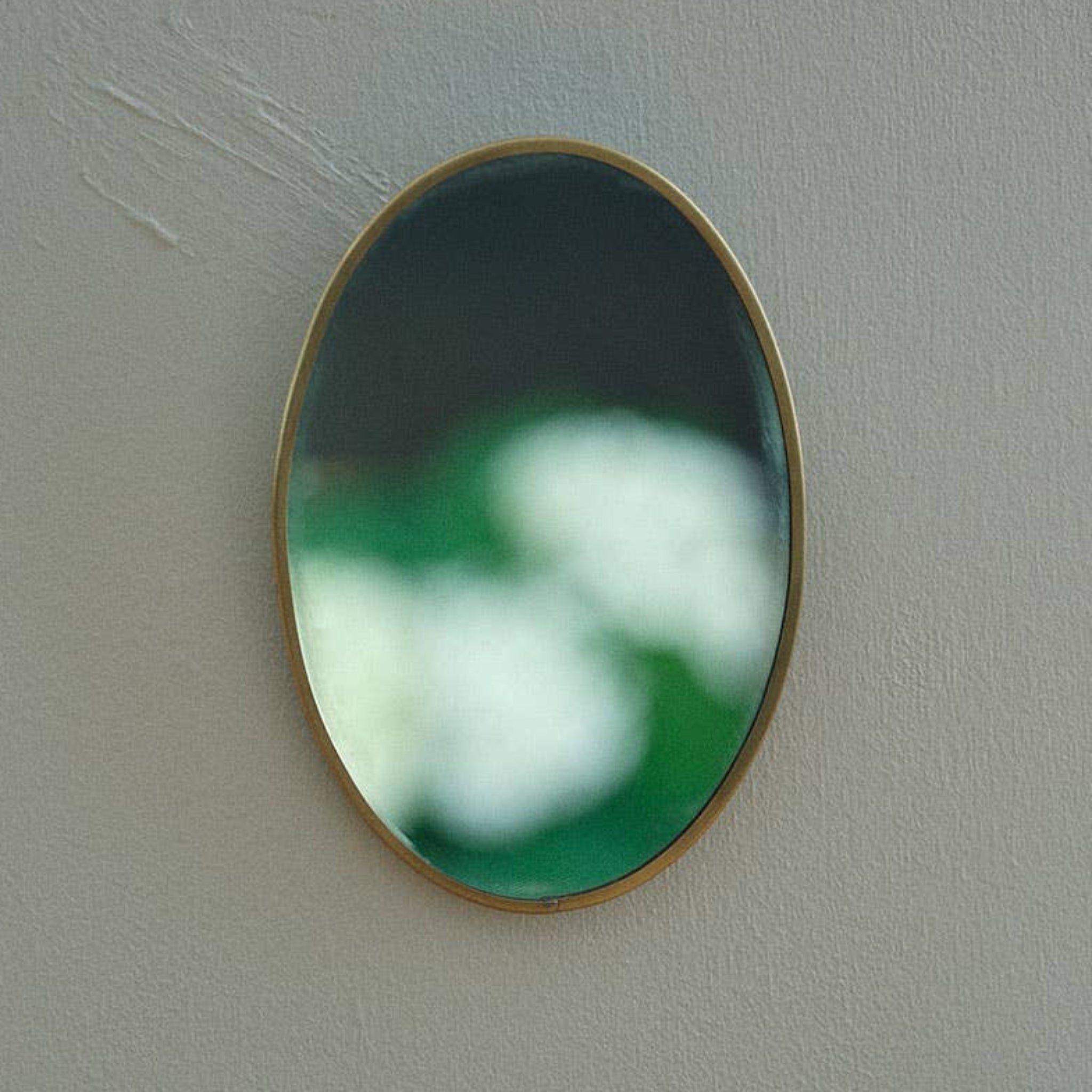 oval brass mirror.