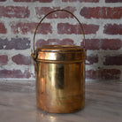 brass bharni pot with lid and handle.