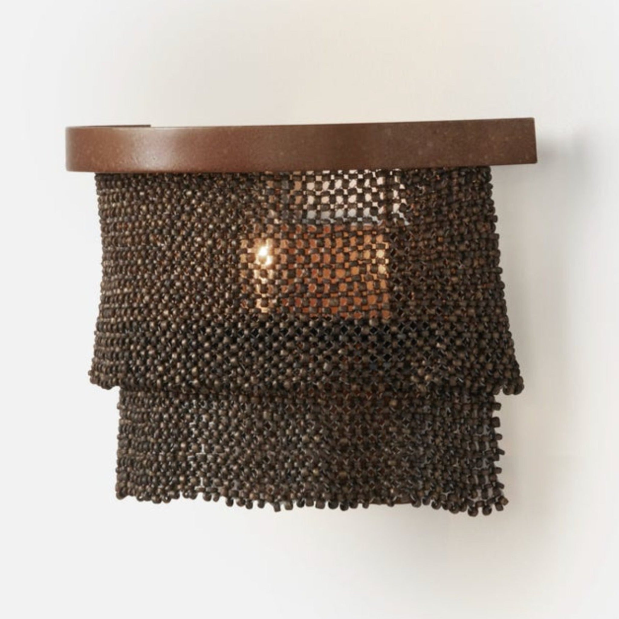 Sophisticated Patricia sconce featuring woven coco beads.