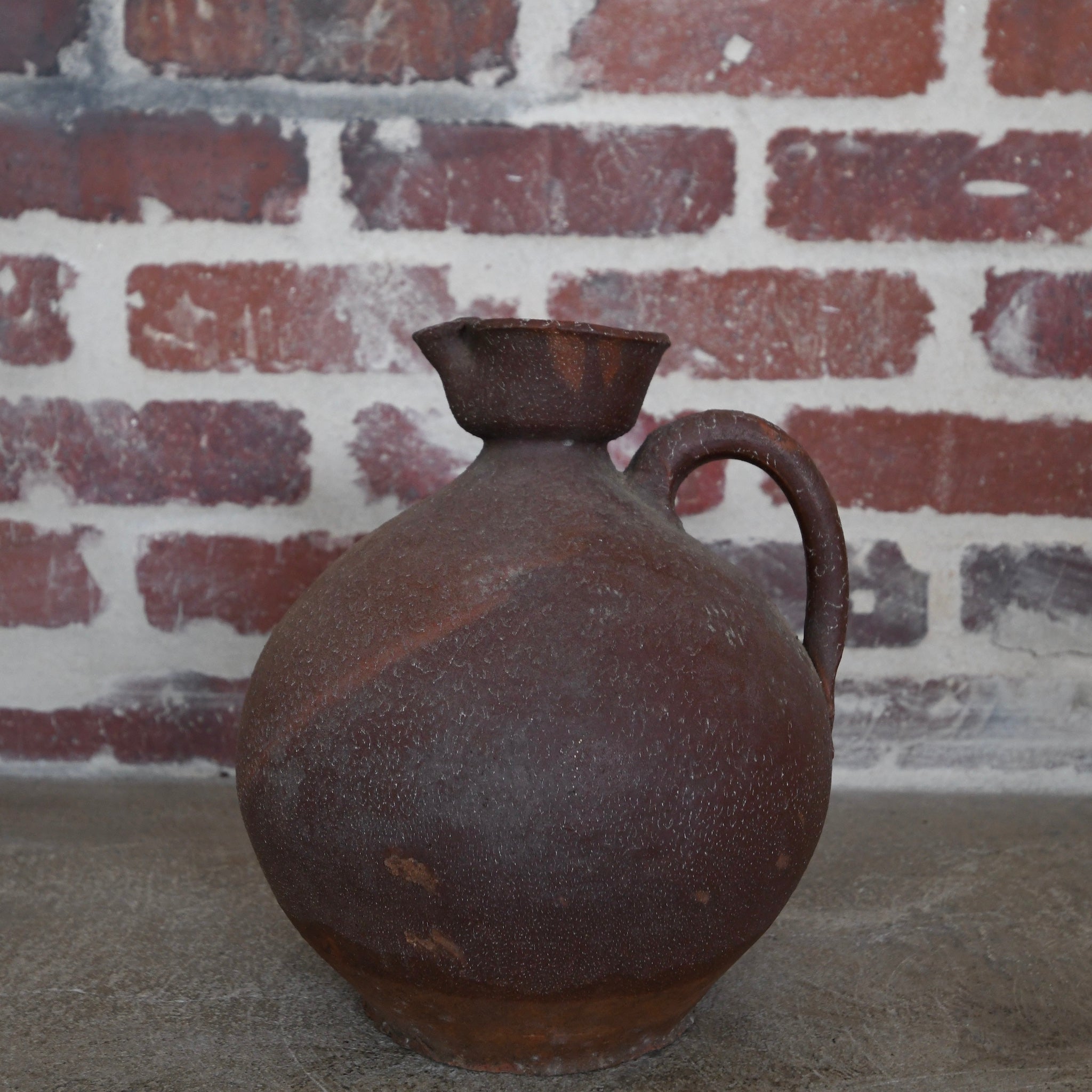 brown ceramic chinese wine bottle.
