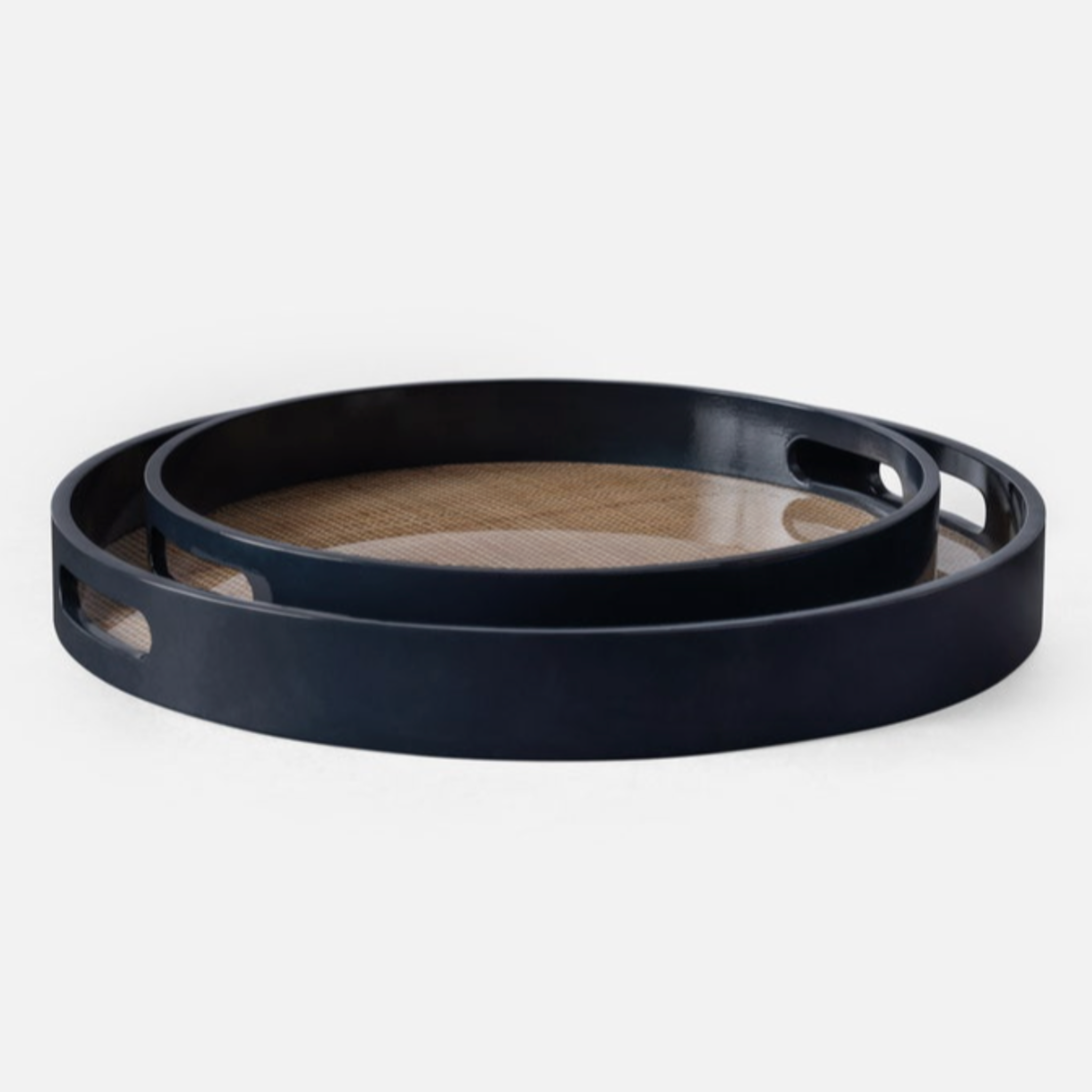 Elijah round tray set featuring two resin-encased cane rattan trays with glossy navy-varnished wood edges, elegant and sturdy for versatile use.