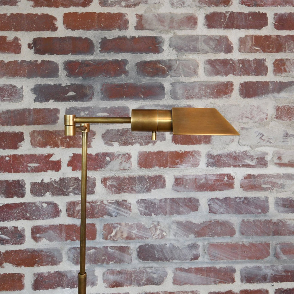 "Vintage Brass Floor Lamp illuminating a reading nook"