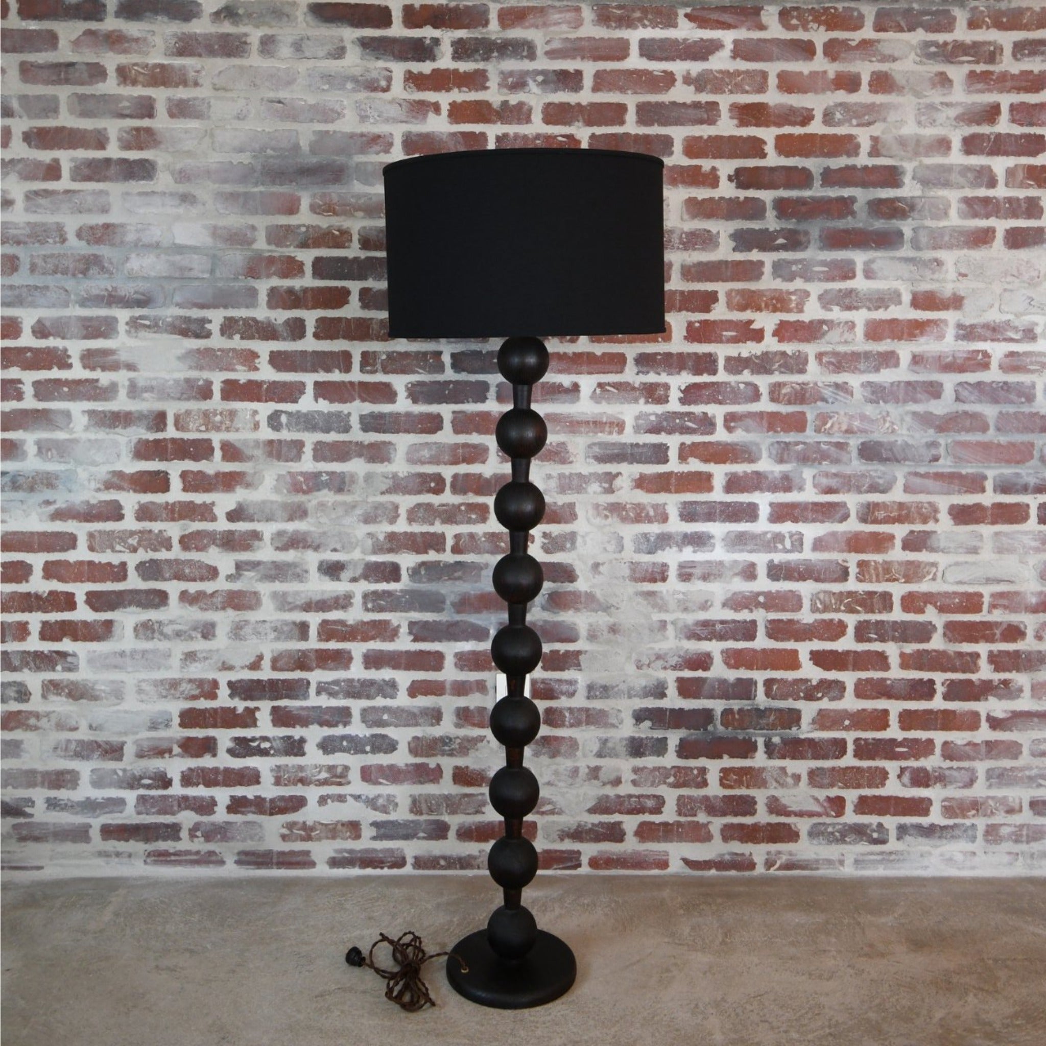 "Hugo Black Wood Barbell Floor Lamp in a contemporary living room"