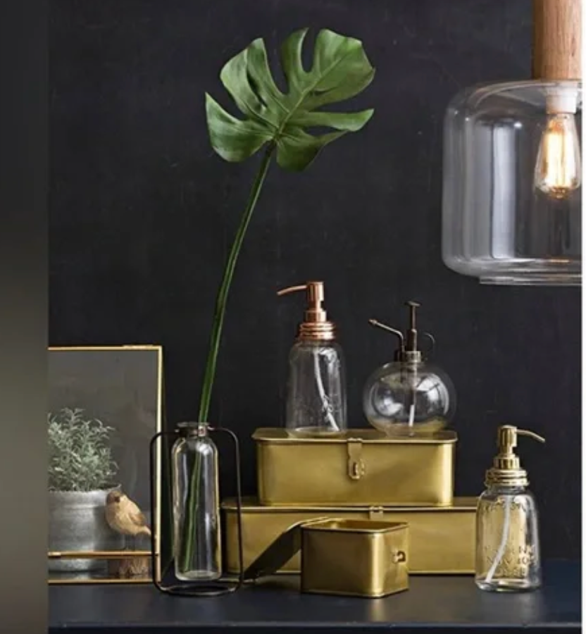 Brass metal storage box with decorative lid for shelves, modern home decor accessory.