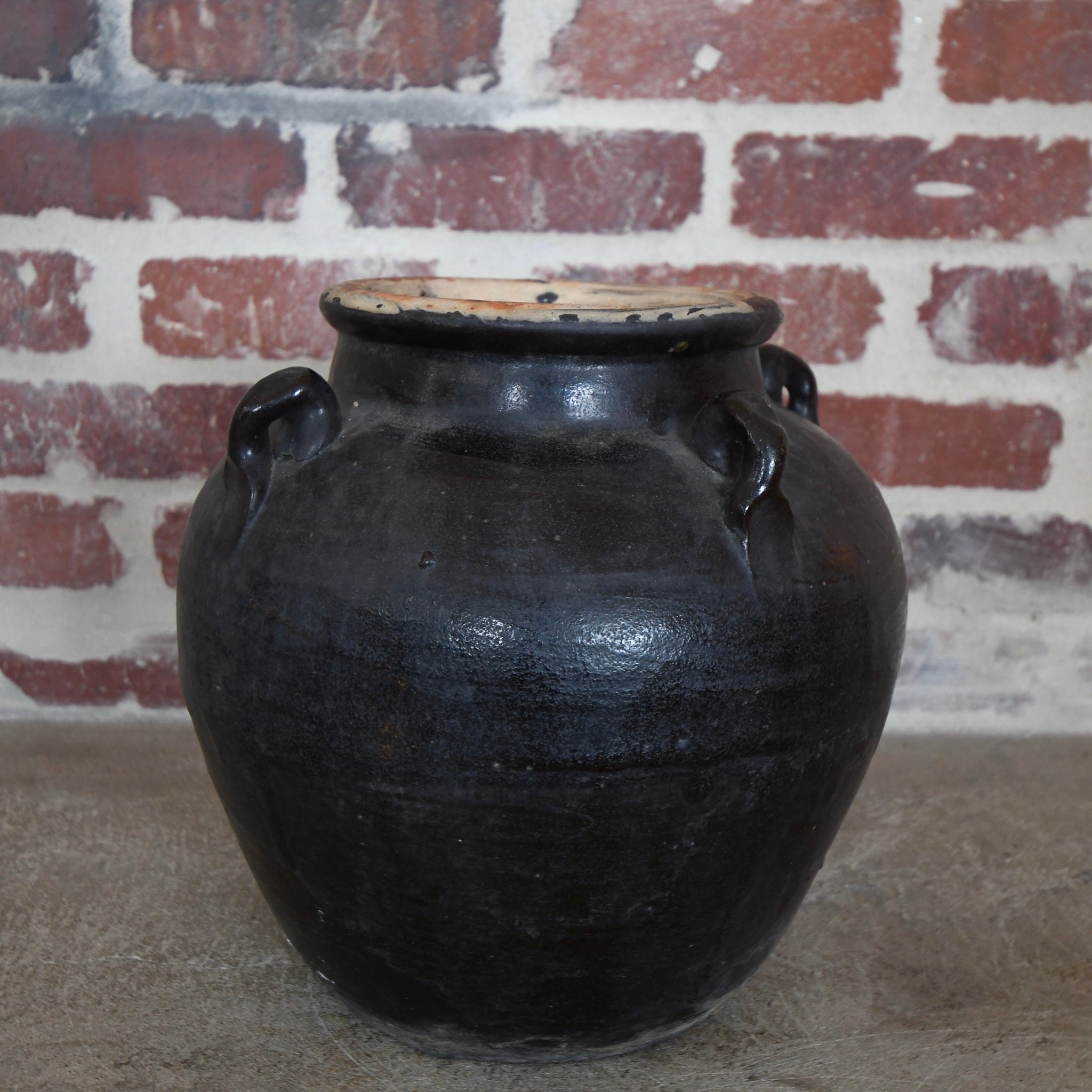large glazed 4-handle pot black.