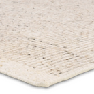 Leonard Rug with handwoven 100% wool construction, neutral cream base, and light brown stripes, 1/2-inch thick, made in India.