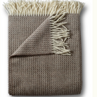 Mushroom-colored throw with subtle diamond pattern, made of 90% Merino wool and 10% cashmere, size 54 by 72 inches, woven in Italy.