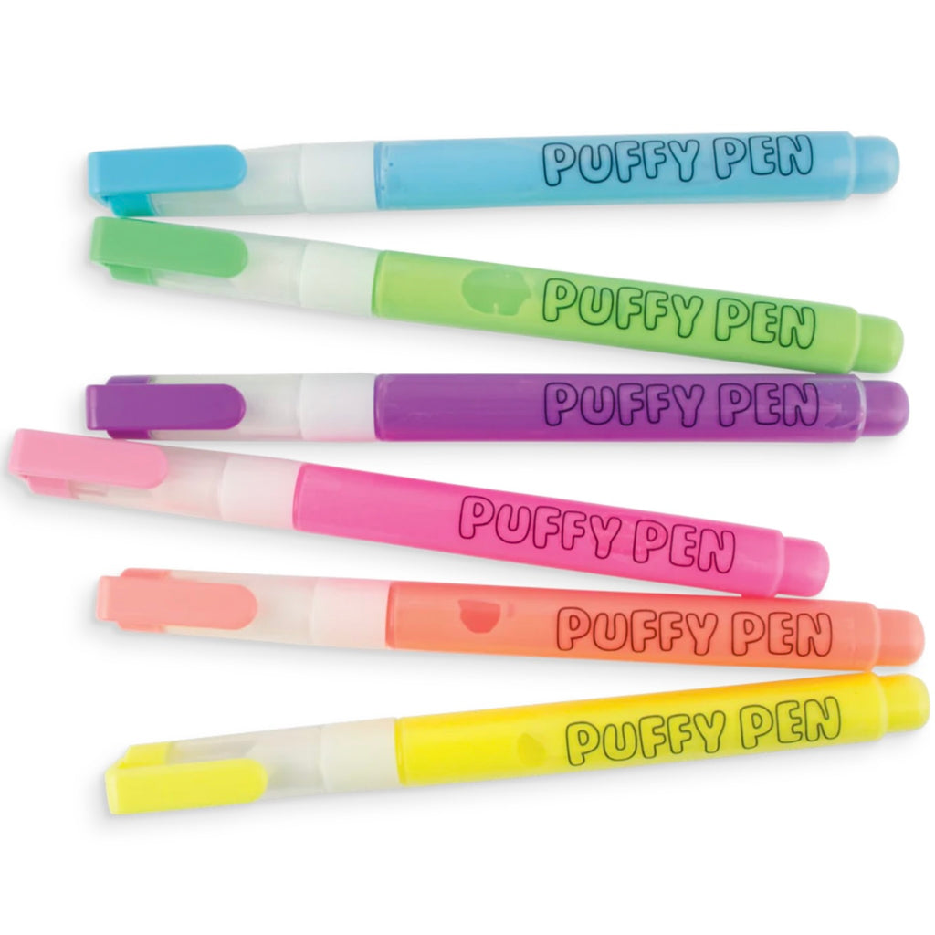 A collection of six neon colored Ooly Magic Puffy Pens laid out in two rows against a white background.