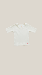 pink chicken - girls organic rib top in antique white.