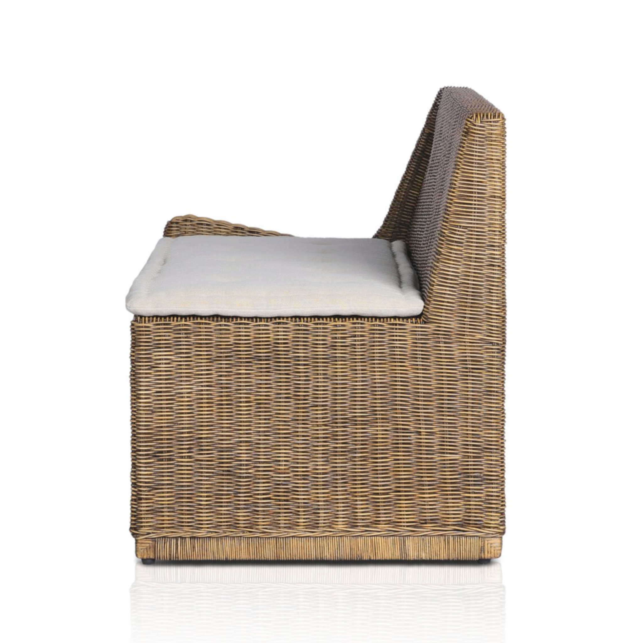 Left arm facing small dining bench with natural woven brown rattan frame and flax/linen cushion in Broadway Dune, 49 inches wide.