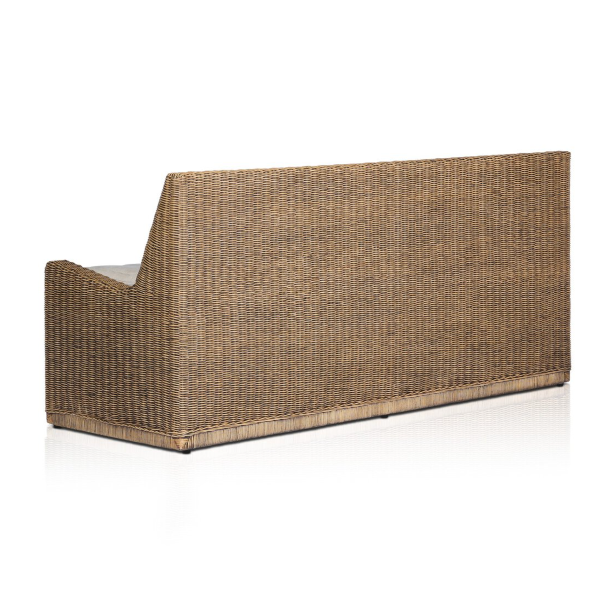Right arm facing large dining bench with natural woven brown rattan frame and flax/linen cushion in Broadway Dune, 72 inches wide.