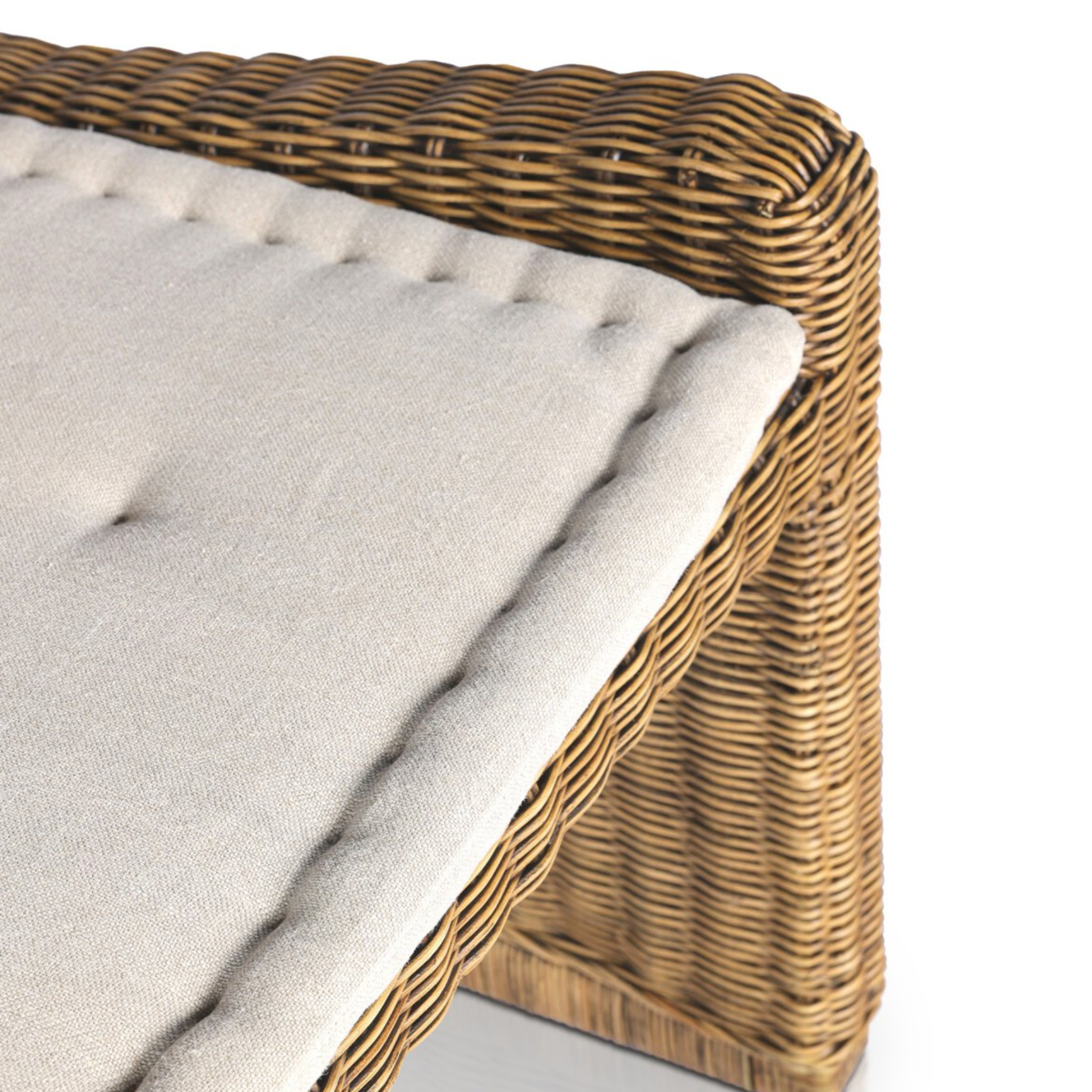 Right arm facing large dining bench with natural woven brown rattan frame and flax/linen cushion in Broadway Dune, 72 inches wide.